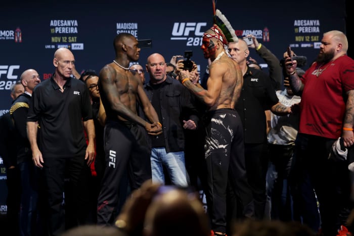 Israel Adesanya and Alex Pereira interact during weigh-ins for UFC 281.
